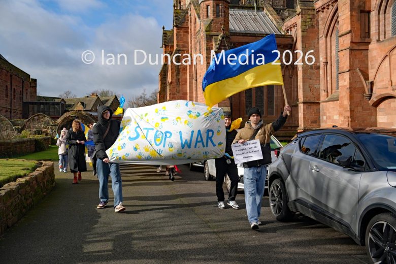 The Stop The War banner heads from Carlisle Cathedral towards the Vigil for Ukraine in the city centre to mark the fourth anniversary of the Russian invasion of Ukraine. Picture: Ian Duncan.