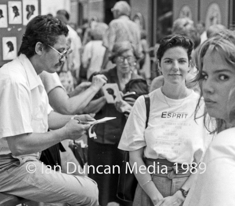 ARTIST... Kim Wilde lookalike (right) looks suspicious as I take a shot of a woman posing for her silhouette in Paris. Picture: Ian Duncan.