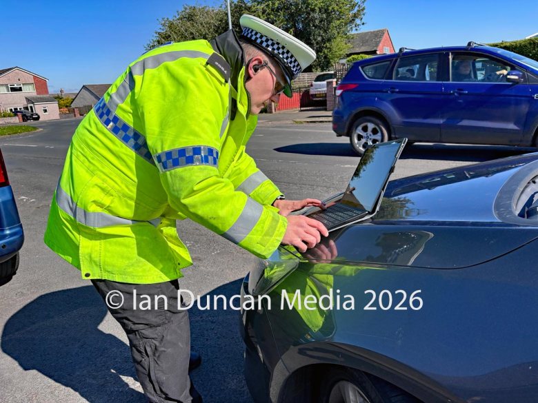 Road safety campaign Operation Colossus in Carlisle where Cumbria police select vehicles at random for inspection in London Road... Officers use a laptop to check vehicle and driver information... Picture: Ian Duncan.