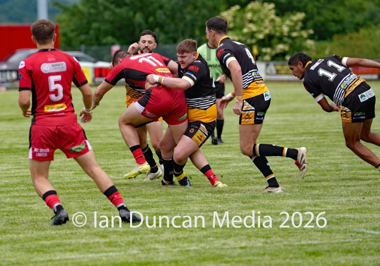 Wath Brow Hornets in black verses Thatto Heath Crusaders in red during a rugby league match in Cleator Moor in Cumbria. Source: Ian Duncan.