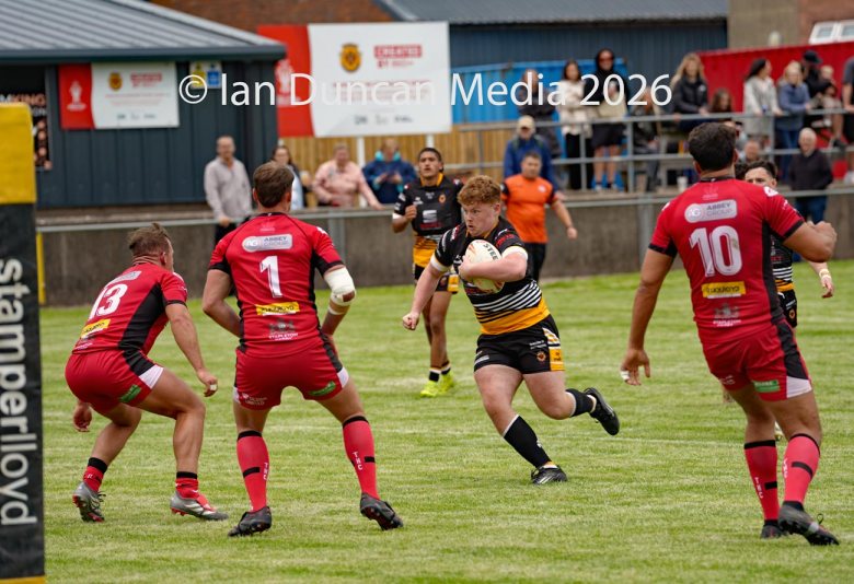 Wath Brow Hornets in black verses Thatto Heath Crusaders in red during a rugby league match in Cleator Moor in Cumbria. Source: Ian Duncan.