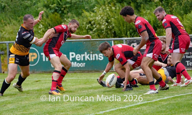 Wath Brow Hornets in black verses Thatto Heath Crusaders in red during a rugby league match in Cleator Moor in Cumbria. Source: Ian Duncan.