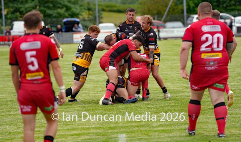 Wath Brow Hornets in black verses Thatto Heath Crusaders in red during a rugby league match in Cleator Moor in Cumbria. Source: Ian Duncan.