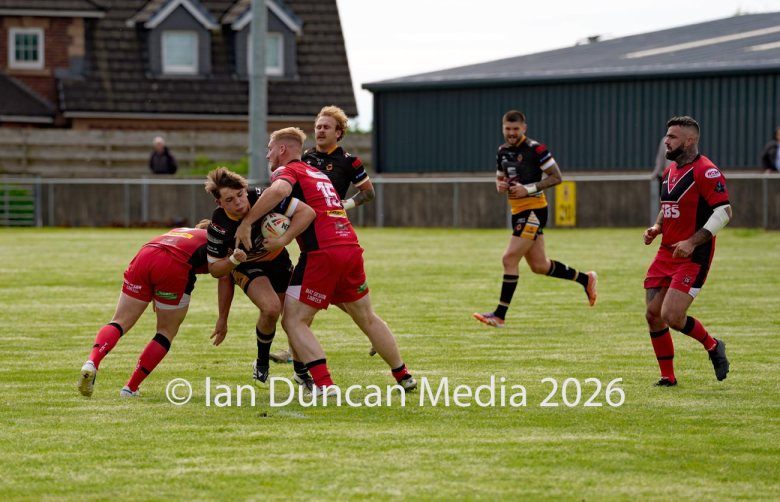 Wath Brow Hornets in black verses Thatto Heath Crusaders in red during a rugby league match in Cleator Moor in Cumbria. Source: Ian Duncan.