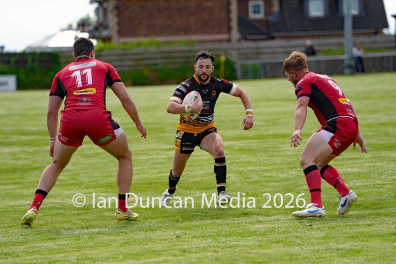 Wath Brow Hornets in black verses Thatto Heath Crusaders in red during a rugby league match in Cleator Moor in Cumbria. Source: Ian Duncan.