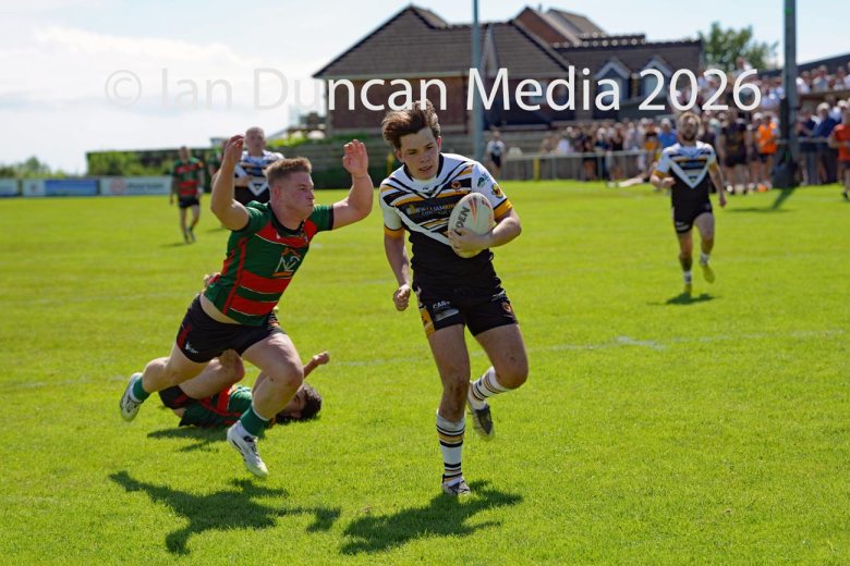 Natty Dougan on his way to scoring a try for Wath Brow hornets, in white shirts, against West Bowling. Picture by Ian Duncan.
