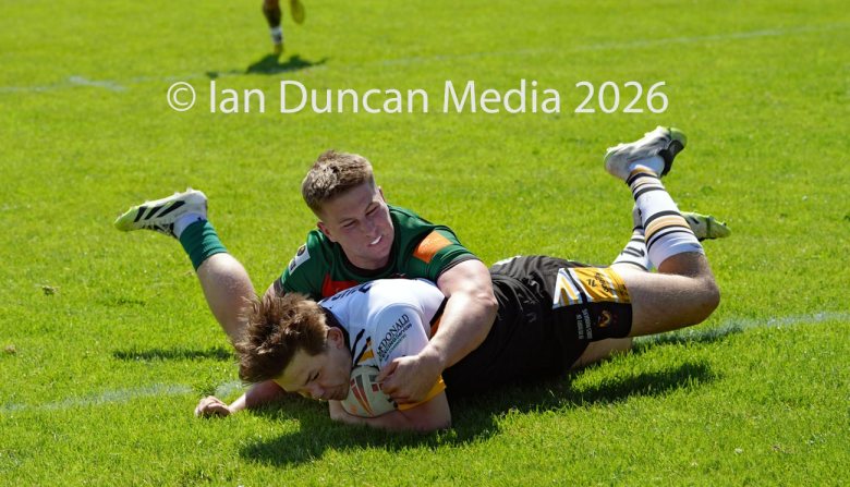 Natty Dougan scores his try for Wath Brow hornets, in white shirts, against West Bowling. Picture by Ian Duncan.