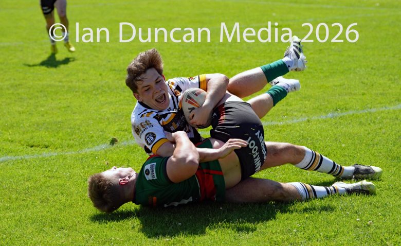 Natty Dougan scores his try for Wath Brow hornets, in white shirts, against West Bowling. Picture by Ian Duncan.