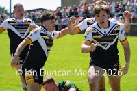 Natty Dougan celebrates after scoring his try for Wath Brow hornets, in white shirts, against West Bowling. Picture by Ian Duncan.
