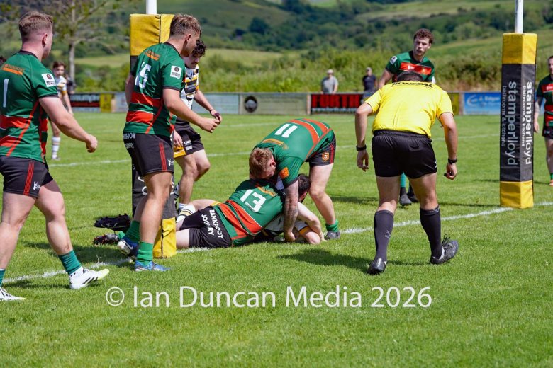 Owen McCartney scores his try for Wath Brow hornets, in white shirts, against West Bowling. Picture by Ian Duncan.