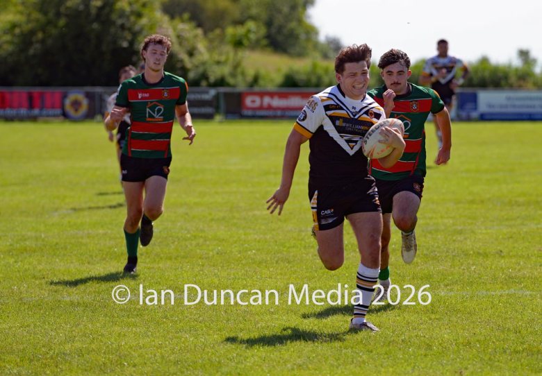 Natty Dougan on his way to scoring a try for Wath Brow hornets, in white shirts, against West Bowling. Picture by Ian Duncan.