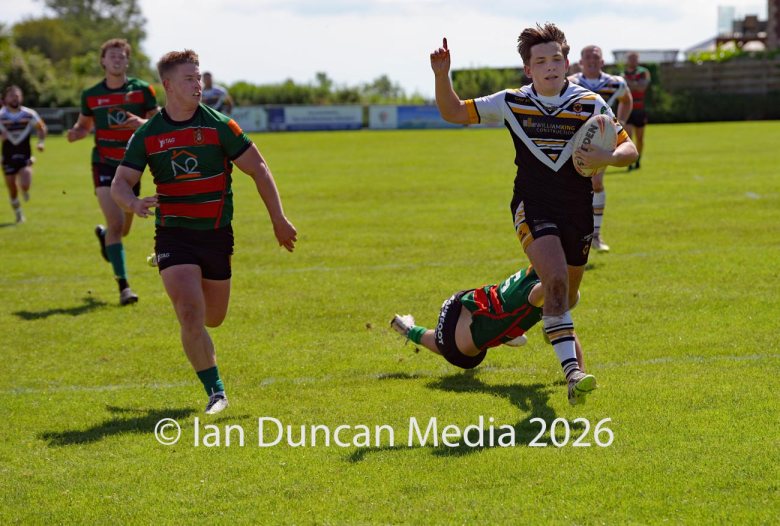 Natty Dougan on his way to scoring a try for Wath Brow hornets, in white shirts, against West Bowling. Picture by Ian Duncan.