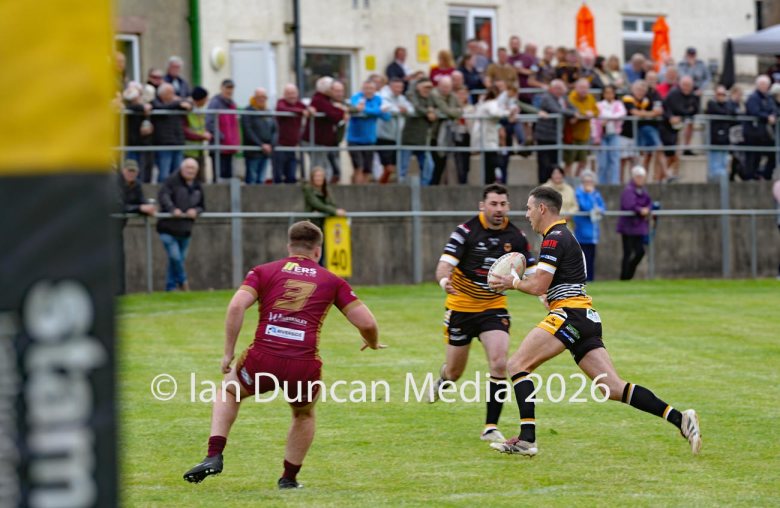 ACTION... Wath Brow Hornets in black during their rugby league match against Wigan St Judes at Giel Park in the Wath Brow area of Cleator Moor. In the end the score was 22-24 thanks to a last minute try by Wigan... Picture: Ian Duncan...