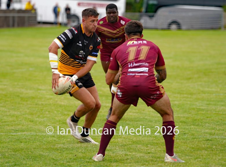 ACTION... Wath Brow Hornets in black during their rugby league match against Wigan St Judes at Giel Park in the Wath Brow area of Cleator Moor. In the end the score was 22-24 thanks to a last minute try by Wigan... Picture: Ian Duncan...