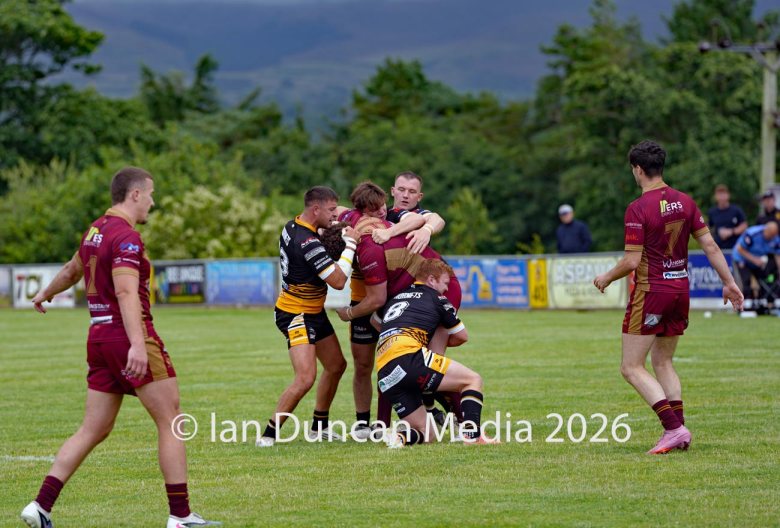 ACTION... Wath Brow Hornets in black during their rugby league match against Wigan St Judes at Giel Park in the Wath Brow area of Cleator Moor. In the end the score was 22-24 thanks to a last minute try by Wigan... Picture: Ian Duncan...