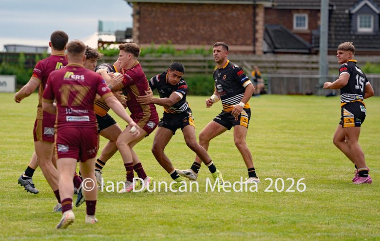 ACTION... Wath Brow Hornets in black during their rugby league match against Wigan St Judes at Giel Park in the Wath Brow area of Cleator Moor. In the end the score was 22-24 thanks to a last minute try by Wigan... Picture: Ian Duncan...
