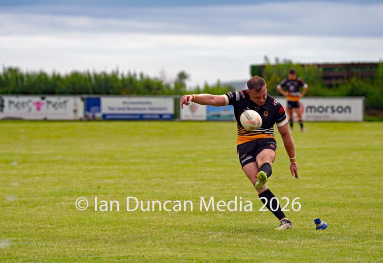 ACTION... Wath Brow Hornets in black during their rugby league match against Wigan St Judes at Giel Park in the Wath Brow area of Cleator Moor. In the end the score was 22-24 thanks to a last minute try by Wigan... Picture: Ian Duncan...