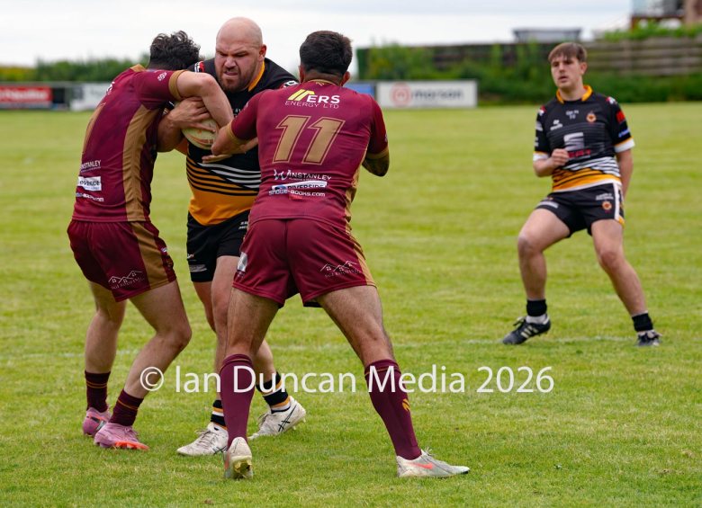 ACTION... Wath Brow Hornets in black during their rugby league match against Wigan St Judes at Giel Park in the Wath Brow area of Cleator Moor. In the end the score was 22-24 thanks to a last minute try by Wigan... Picture: Ian Duncan...