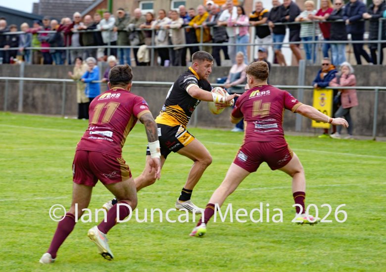 ACTION... Wath Brow Hornets in black during their rugby league match against Wigan St Judes at Giel Park in the Wath Brow area of Cleator Moor. In the end the score was 22-24 thanks to a last minute try by Wigan... Picture: Ian Duncan...