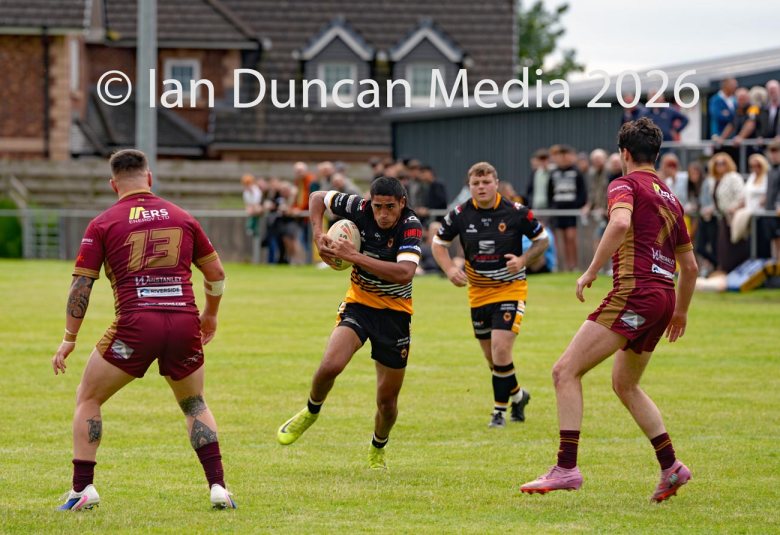 ACTION... Wath Brow Hornets in black during their rugby league match against Wigan St Judes at Giel Park in the Wath Brow area of Cleator Moor. In the end the score was 22-24 thanks to a last minute try by Wigan... Picture: Ian Duncan...