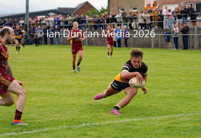 FIRST TRY... 17-year-old Conrad Dockwray scores his first try for Wath Brow Hornets in their rugby league match against Wigan St Judes at Giel Park in the Wath Brow area of Cleator Moor. In the end the score was 22-24 thanks to a last minute try by Wigan... Picture: Ian Duncan...