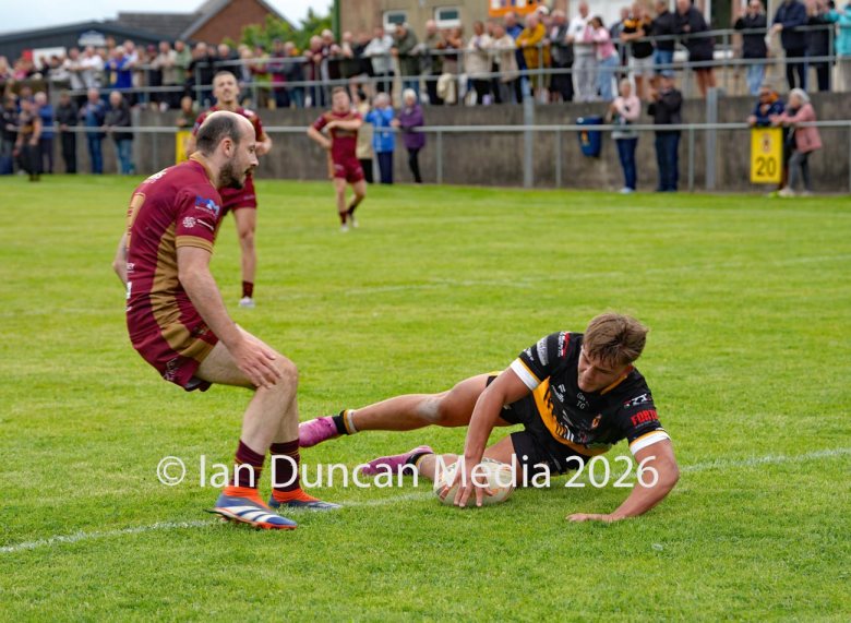 FIRST TRY... 17-year-old Conrad Dockwray scores his first try for Wath Brow Hornets in their rugby league match against Wigan St Judes at Giel Park in the Wath Brow area of Cleator Moor. In the end the score was 22-24 thanks to a last minute try by Wigan... Picture: Ian Duncan...