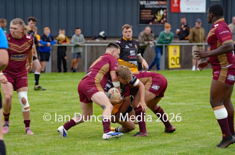 ACTION... Wath Brow Hornets in black during their rugby league match against Wigan St Judes at Giel Park in the Wath Brow area of Cleator Moor. In the end the score was 22-24 thanks to a last minute try by Wigan... Picture: Ian Duncan...